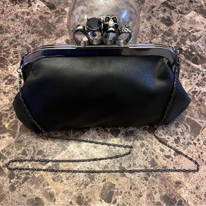 Black Knuckle Clutch with skulls and black crystal detail.